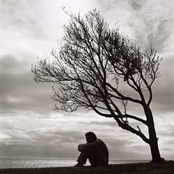 Loneliness man under tree